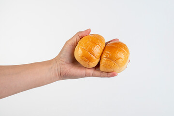 Bread loaf in hand on white background