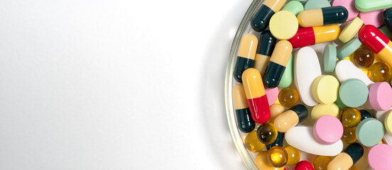 Colorful pills and capsules medicine assortment on white background pharmacy