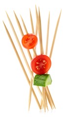 Skewered fresh vegetables on wooden toothpicks, isolated on white background
