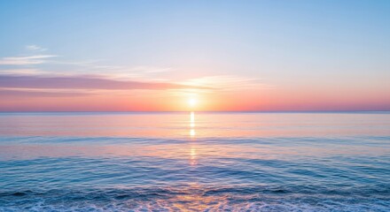 Serene ocean sunrise or sunset with the sun reflecting brightly on the calm water surface and gentle waves washing onto the shore under a pastel colored sky