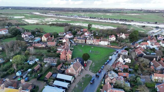 Walberswick Village Suffolk UK pull back drone aerial reverse reveal