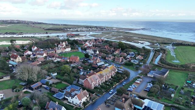 High angle Panning drone aerial Walberswick Village Suffolk UK