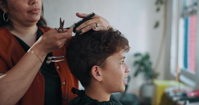 Hairdresser, hands and haircut for child, scissors and hair maintenance with equipment and haircare. Salon, boy and woman with tools for hairstyle trim, consultation and hairdo with comb for texture