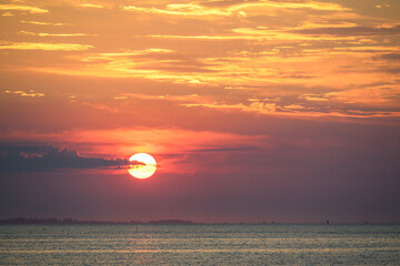 Moody sky at sunset in pastel blue, purple, pink, and yellow, as a nature background
