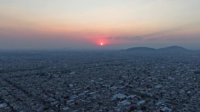 Hyperlapse footage from a drone at sunset over Ecatepec&rsquo;s urban neighborhood