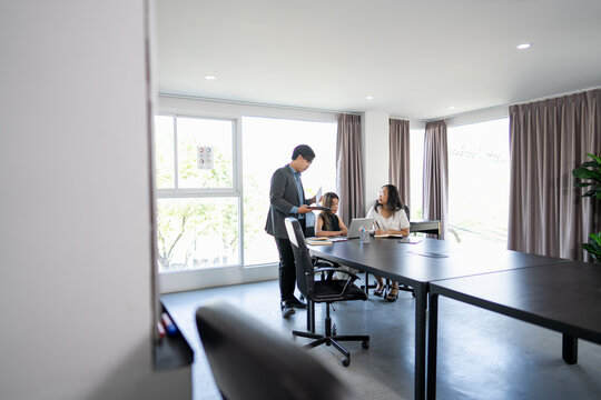 Young Business Professionals Collaborating on a Business Project in a Meeting Room.