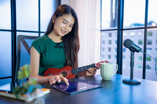 Content creator Young asian woman influencer creating content in home studio entertainment and communication blogger video record with smartphone for online vlog