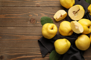 Sweet ripe quinces on wooden background