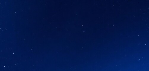 Obraz premium Deep blue night sky, star-filled, cosmic dust, sparkle, vibrant