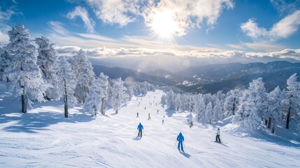 Skiers enjoying winter snow on mountain resort slopes