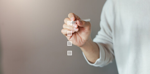 close up businessman hand check online questionnaire survey from website to rate score and share...