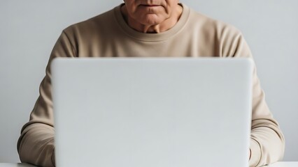 Senior Man Using Laptop Connecting, Working, and Embracing Technology in Modern Times