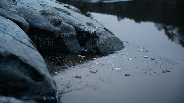 Ice scaped rock at a lake in the Winter in Norway on a cold day