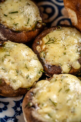 Baked stuffed mushrooms with melted cheese