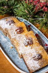 Festive walnut cake bars with powdered sugar