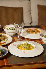 Indulge in Gourmet Dishes Served Within a Modern and Elegant Dining Setting Experience