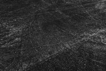 Close up black tire marks on cement floor.