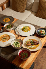 An Exquisite and Delicious HomeCooked Meal Beautifully Spread Across a Wooden Table
