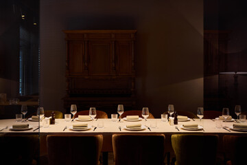 formal boardroom dining scene featuring neatly folded napkins and subtle lighting ambiance