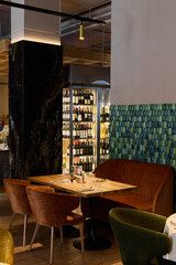 elegant wine dining, chic glassware and plush seating, cozy corner with wine storage and soft lights