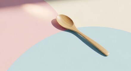 Wooden spoon on pastel background offers minimalist kitchen aesthetic