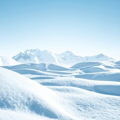 Fototapeta premium Snowy peaks, hills, and valley under clear blue sky