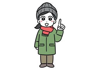 笑顔で指差しポーズをしているマフラーを巻いた冬服の若い女性(全身・正面)