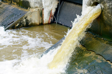 Industrial Wastewater Discharge Flowing Into a Water Body