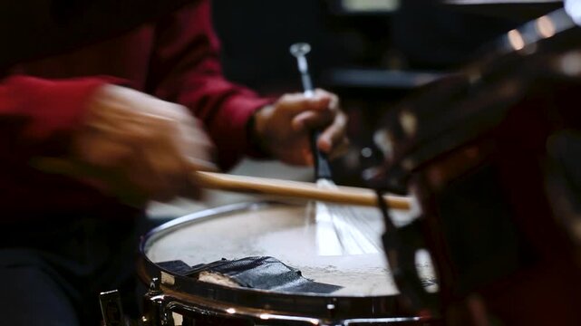Man Playing Drum Set in Music Studio