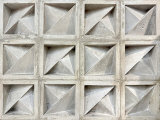 Pattern of molded clay or ceramic latticework, called Roster or breeze blocks, in geometric diagonal and triangular pattern. Roster is usually used as secondary skin of wall finishes in architecture.