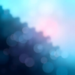 This abstract image features a soft, dreamy blend of light blue and pink hues, creating a gentle gradient. The left side is characterized by blurred, cloud-like shapes in a darker, more intense blue, 