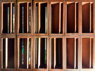 Pattern of molded brick clay latticework, called Roster or breeze blocks, in geometric diagonal and triangular pattern. Roster is usually used as secondary skin of wall finishes in architecture.