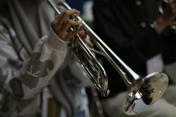 Obraz premium Closeup of Trumpet Player Practicing in a Music Rehearsal Room