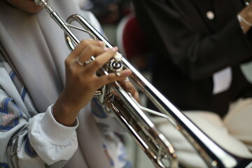 Closeup of Trumpet Player Practicing in a Music Rehearsal Room