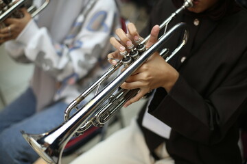 Closeup of Trumpet Player Practicing in a Music Rehearsal Room