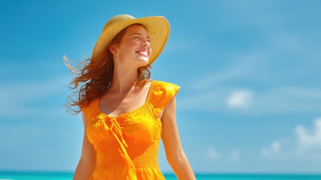 A woman smiles brightly while standing on a beach wearing a vibrant orange dress and a wide brimmed hat. The clear blue sky and ocean create a perfect summer scene.