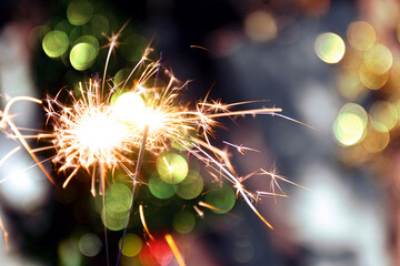 beautiful bokeh of christmas sparkler, holiday background and happy new year creating festive atmosphere for celebration or holiday event