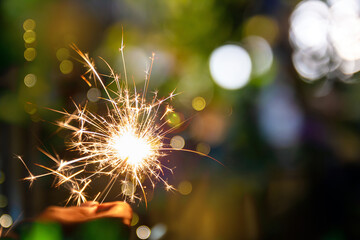 beautiful bokeh of christmas sparkler, holiday background and happy new year creating festive atmosphere for celebration or holiday event