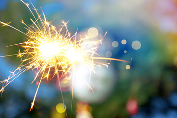 beautiful bokeh of christmas sparkler, holiday background and happy new year creating festive atmosphere for celebration or holiday event