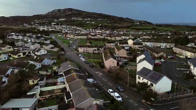 Rainy Holyhead homes aerial view above small island town neighbourhood mountain real estate