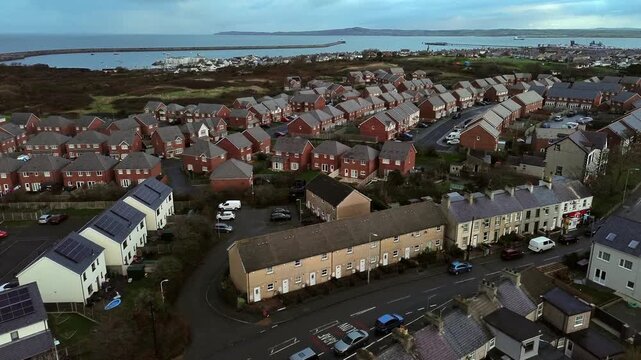 Rainy Holyhead homes aerial view overlooking small island town neighbourhood real estate properties