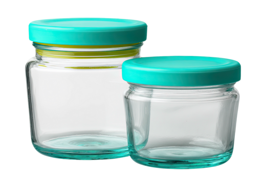 Two clear glass jars with teal lids on black background