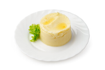 Mashed potato dish served on a white plate with fresh lettuce garnish