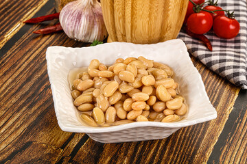 Baked white canned beans in the bowl