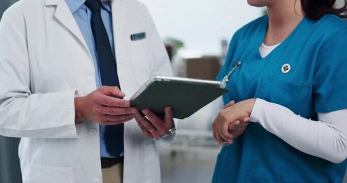 Hands, nurse and doctor with tablet in clinic for EHR system, medical results review and feedback. People, professional team or digital app with discussion on health insurance and opinion in hospital