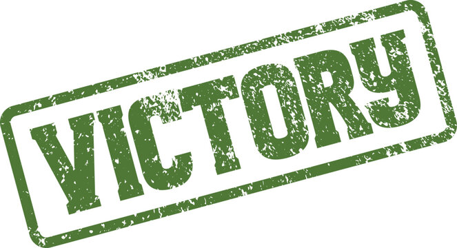 An authentic green rubber stamp marking the triumphant word victory symbolizing success and achievement