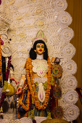 Fototapeta premium Subho mahalaya, An handmade colorful idol of hindu god kartikeya decorated in Pandal during navratri festival.
