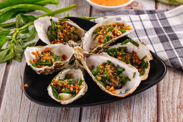 Gournet grilled oysters with onion and peanut