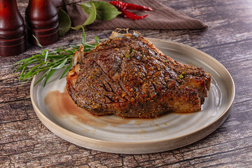Baked beef steak on the bone