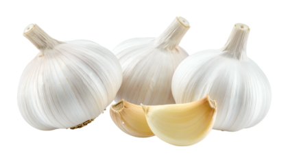 Four garlic bulbs, one with two cloves showing, against a dark background, in full focus